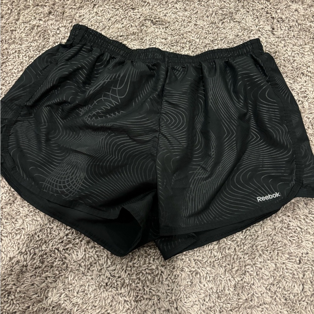 Low waisted black patterned running shorts